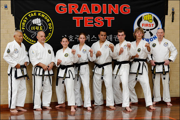 First Tae Kwon Do Master Vernon Low, Chief Instructors, and newly promoted black belt members, December 2023, Perth
